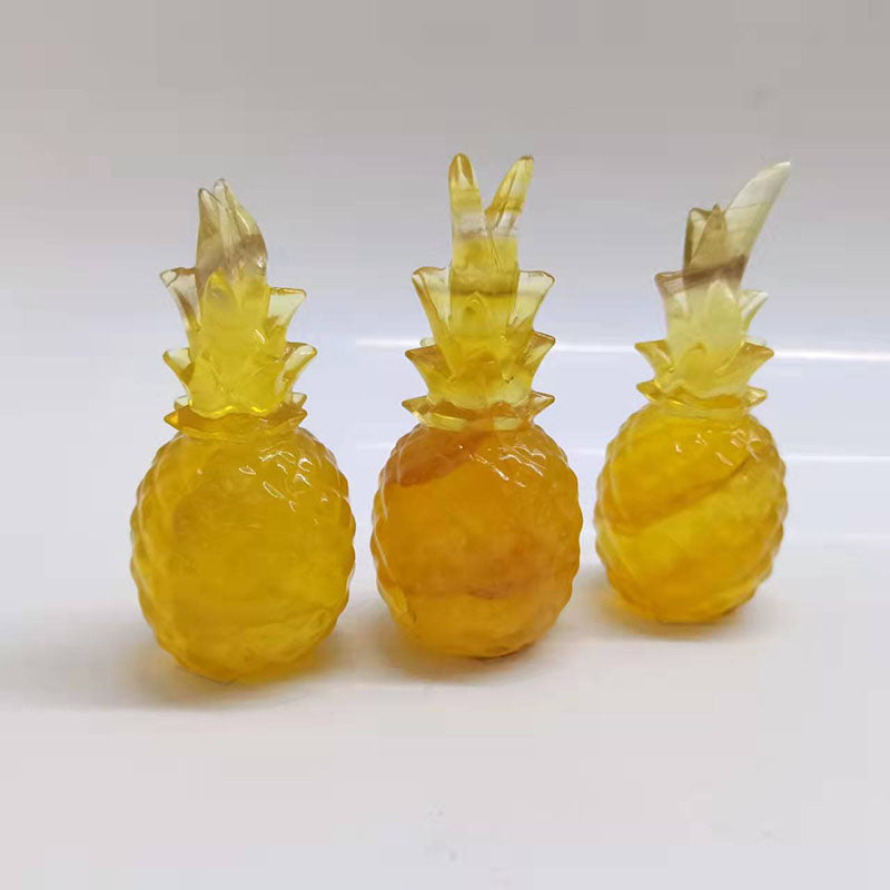 Purple and Yellow Fluorite Pineapple Carvings